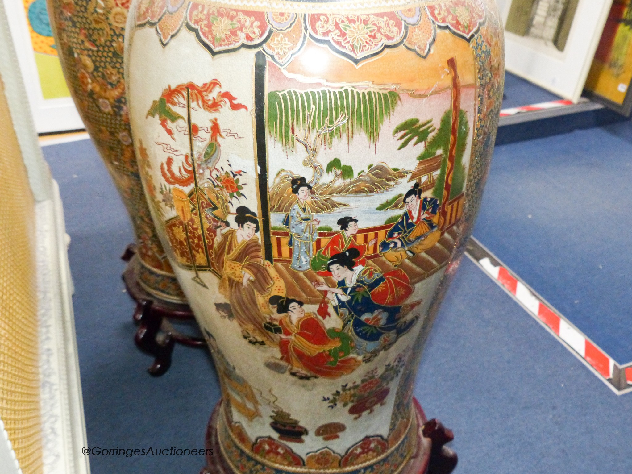 A pair of large Japanese vases, on hardwood stands